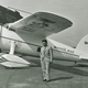 Wiley Post poses with his Lockheed Vega Winnie Mae at Floyd Bennett Field in 1933 (Smithsonian)